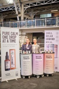 Water Junkie team at event, giving out product samples