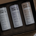 Water Junkie taster pack box open on a wooden surface revealing all three flavours