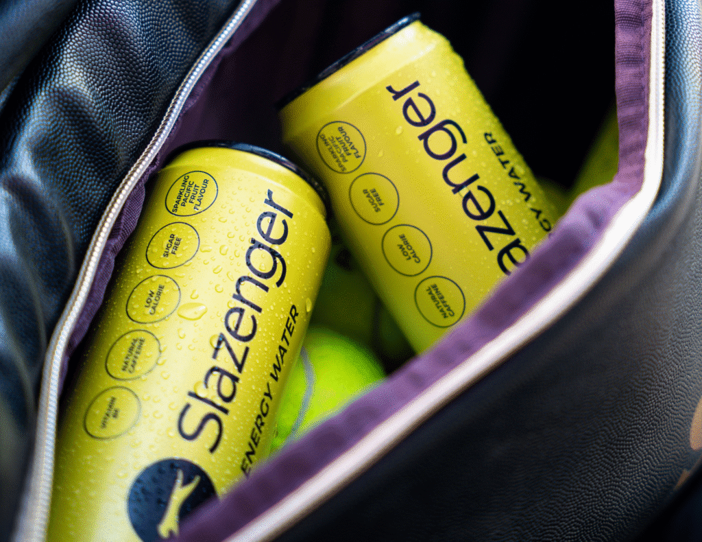 Slazenger Energy Water cans placed in Gym bag amongst tennis balls
