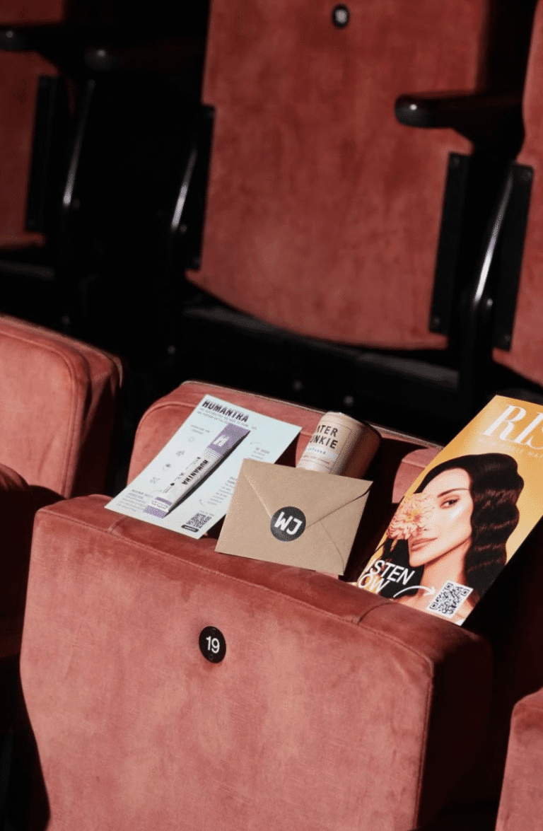 Water Junkie cans in seats at Roxie Nafousi's Manifest Live event