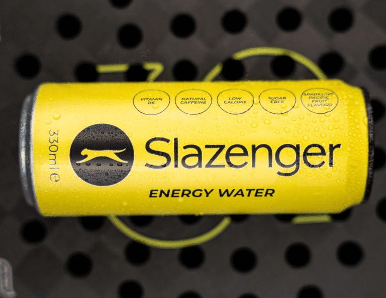 A Slazenger Energy Water can facing upwards on a Padel Racket